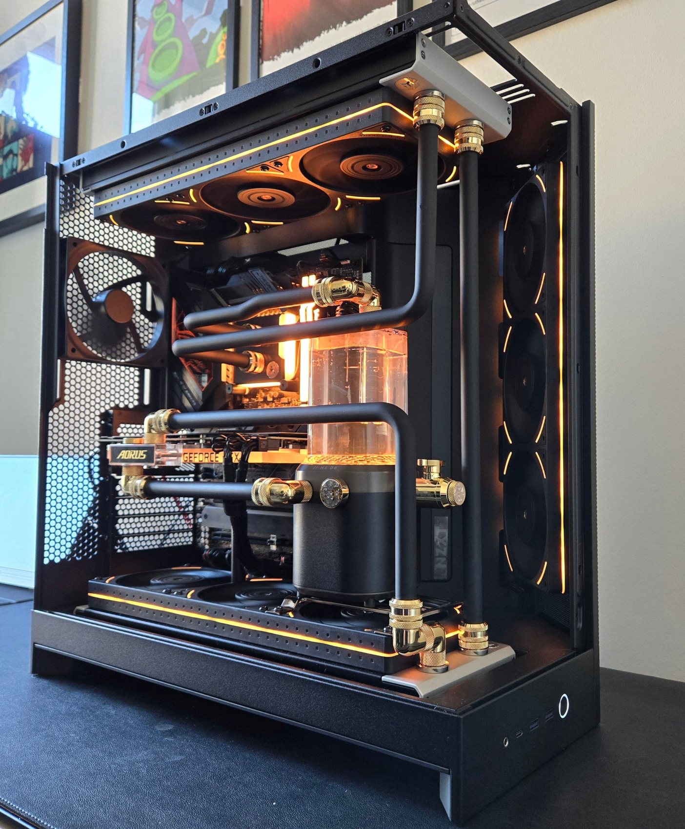 Midas, a custom water-cooling build in a black case with gold fittings and amber coolant, by Water-cooling Design