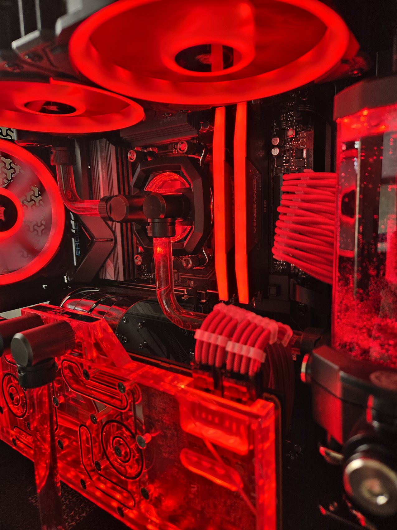 Red mesh-case build detail, CPU block and RAM