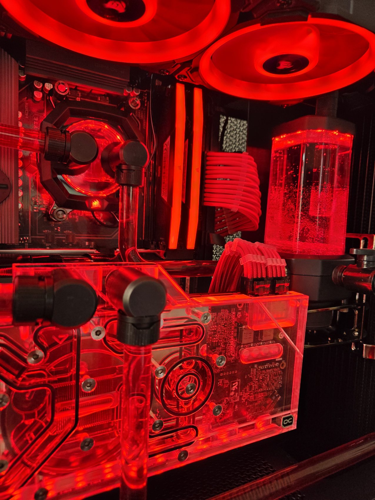 Red mesh-case build detail, GPU block and reservoir