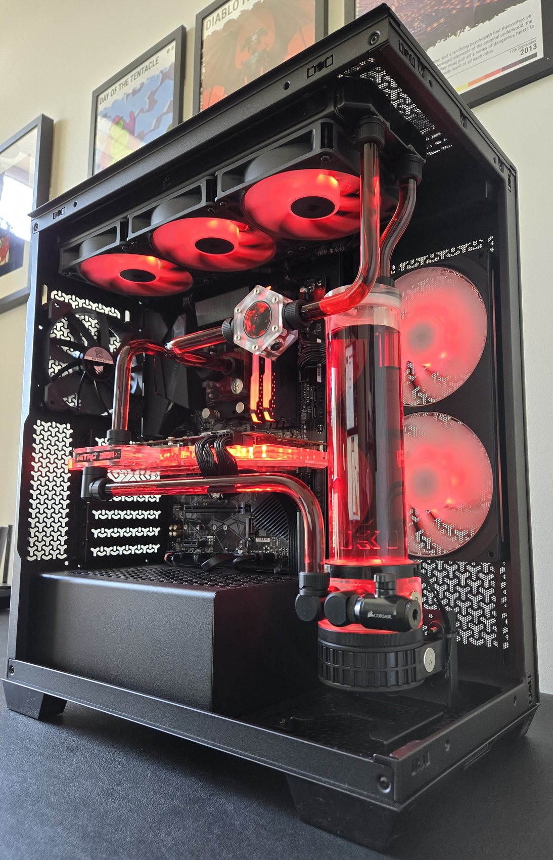 Detail of custom water-cooling loop with red coolant, built by Water-cooling Design